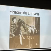 720361542_1297871742500649_8534214721983193725_n Slide titled 'Histoire du cheveu' showing a sepia photo of a person beside an old hair curling device.